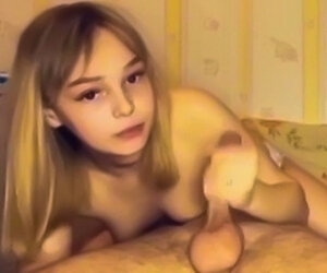 video with a young lolita with a vacuum mouth, she is naked in her crib doing a super sperm suction on her young face